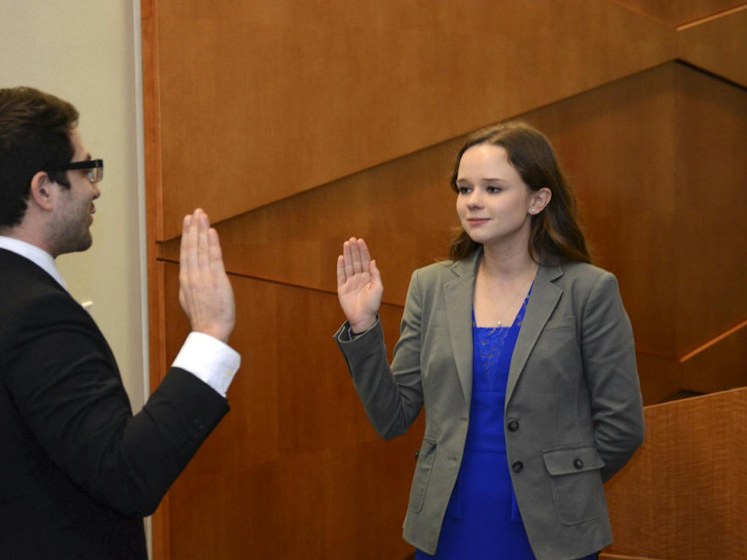 Former Senate President Pro-Tempore Jenny Clements is sworn in as Senate President by UF Student Body Chief Justice Andy Schein in the Reitz Union Senate Chamber on Feb. 23, 2016.