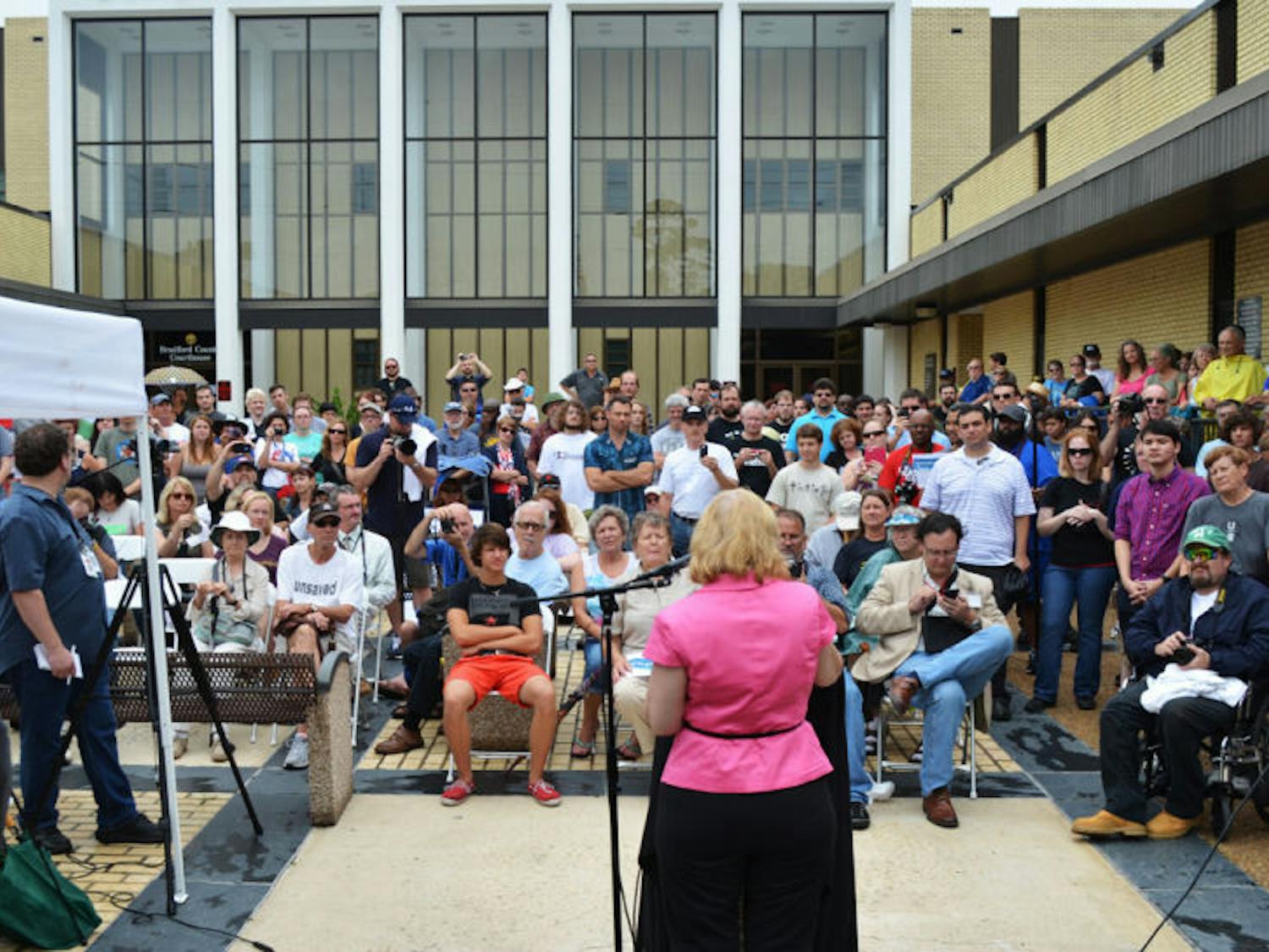 Jeanette Madea, Ph. D., coordinator for Center for Inquiry in Fort Lauderdale, speaks to a crowd during the unveiling of an atheist monument outside the Bradford County Courthouse on Saturday, June 29, 2013 in Starke, Fla.
