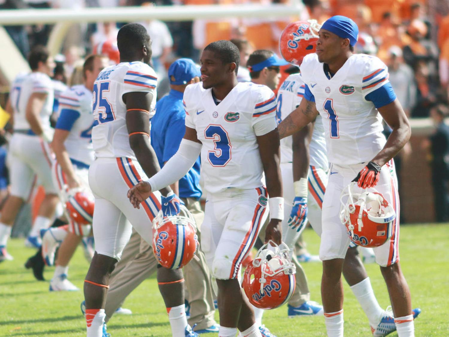 UF quarterback Treon Harris (3) walks off the field of Neyland Stadium with wide receiver Quinton Dunbar (1) following Florida's 10-9 win against Tennessee on Saturday in Knoxville, Tenn.