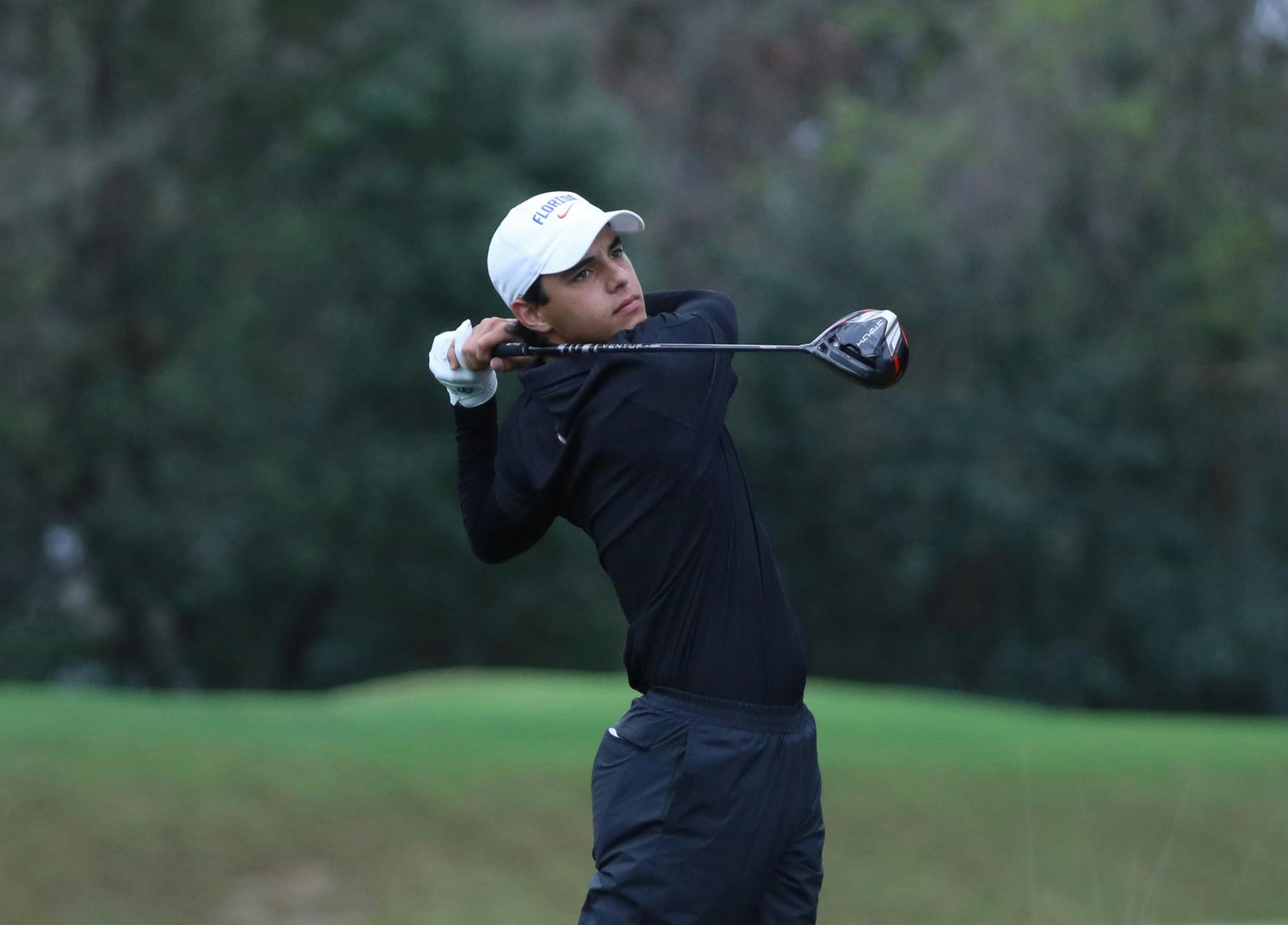 Florida redshirt freshman Miguel Leal swings his club in the VyStar Credit Union Gators Invitational Saturday, February 11, 2023. / Photo by Lorenzo Vasquez