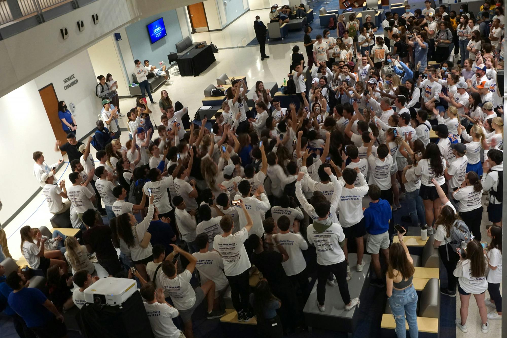Members of Gator and Change Parties await Student Government election results on Wednesday, Feb. 23 at the Reitz Union.