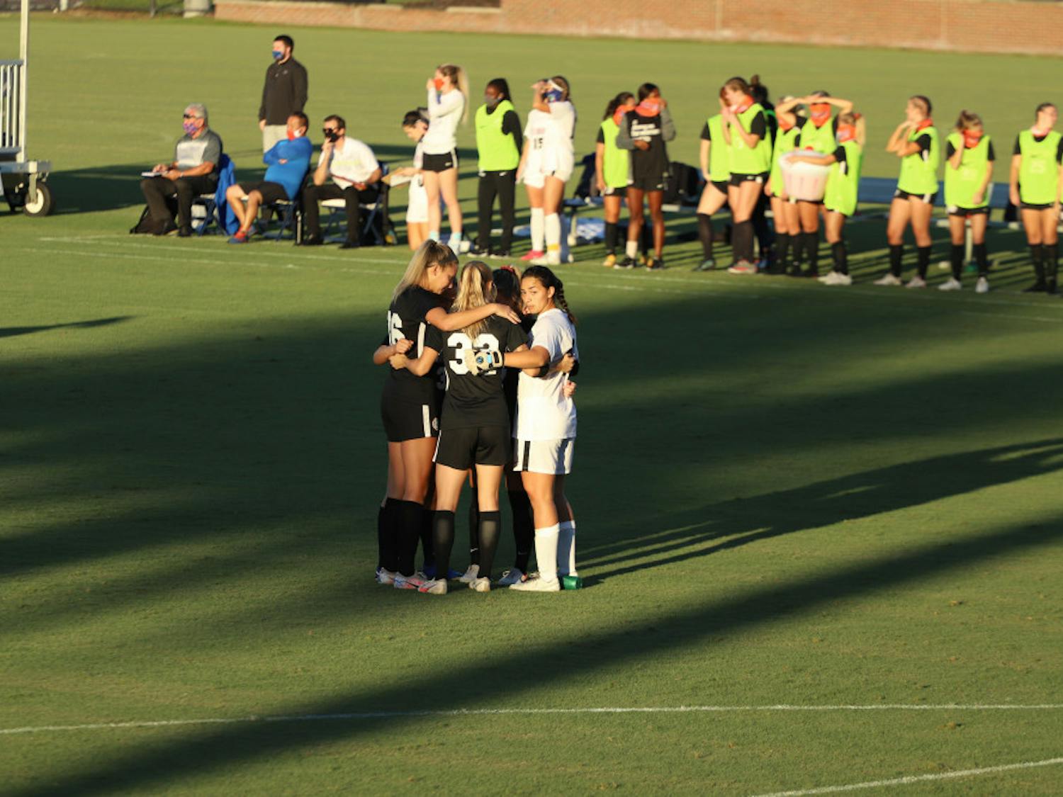 Gators stand in a huddle in their final home game of the 2020 season. Florida will play two road games this weekend against SEC opponents Kentucky and Missouri.