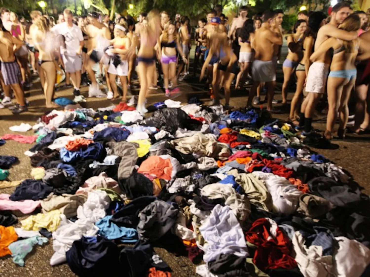 Participants in the Fall 2012 Underwear Dash strip off their clothes, which will be donated to St. Francis House, a Gainesville homeless shelter and soup kitchen. About 24 trash bags of clothing were donated.