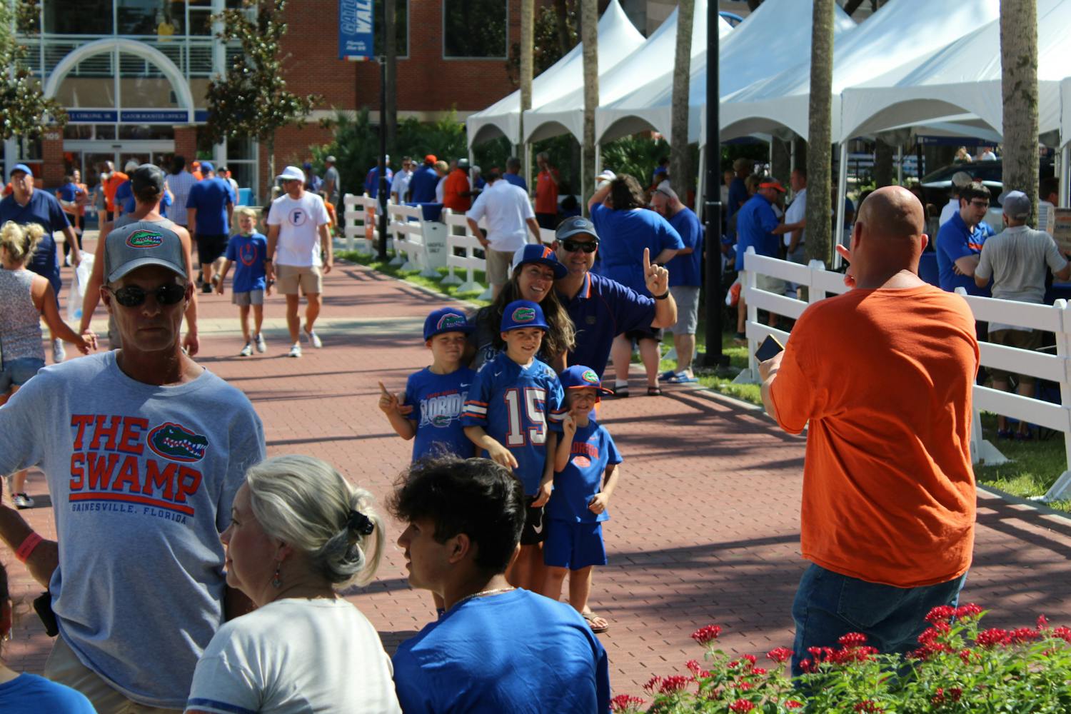 A family of Florida fans takes a picture during a pre-game tailgate in front of Ben Hill Griffin Stadium on Sept. 4.