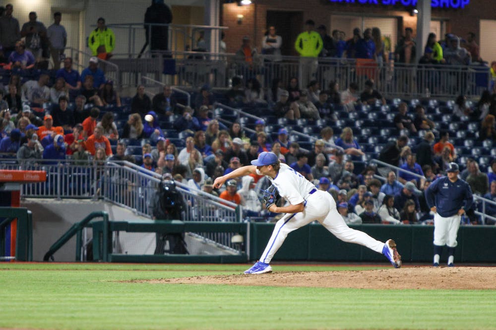 Florida pitcher Brandon Sproat pitches the ball in the Gators' win against the Charleston Southern Buccaneers Friday, Feb. 17, 2023.