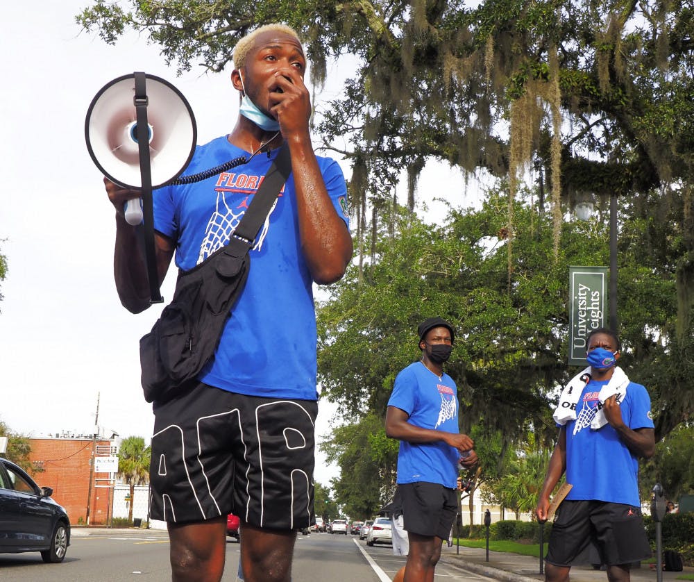 <p>Sophomore guard Scottie Lewis at the Black Lives Matter protest in Gainesville on Aug. 28, which also had members of Florida's football and volleyball teams in attendance.</p>