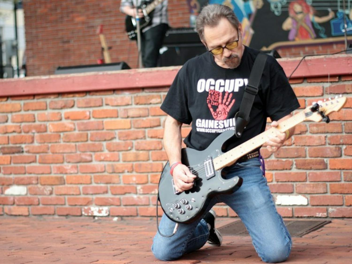 Brian Krashpad, frontman of the local punk rock band Crash Pad, plays downtown at the Fight Back Florida Gainesville Rocks the Vote rally Saturday afternoon.
