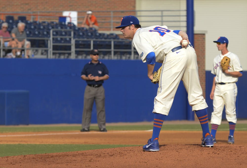 <p>Right-hander Tucker Simpson gets ready to throw a pitch during Florida's 8-3 loss to Florida Gulf Coast on Feb. 23 at McKethan Stadium. After one season with the Gators, Simpson will transfer from UF. </p>