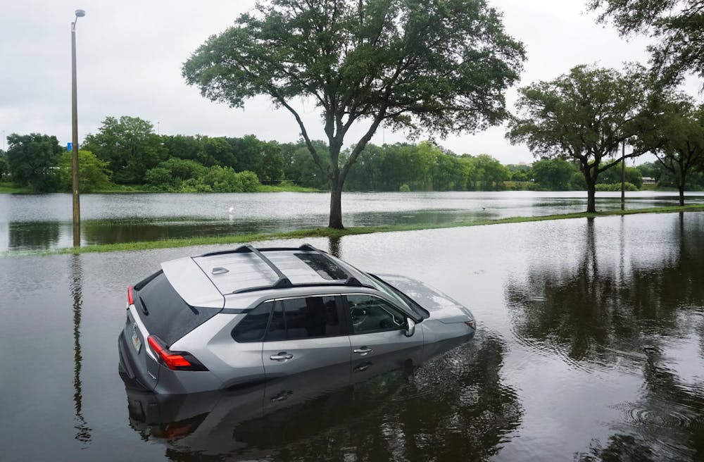 A deserted Toyota RAV-4 on Northwest Fourth Boulevard in Gainesville on Wednesday, July 7, 2021. The Gainesville Police Department stated this vehicle and one other got stuck after drivers attempted to cross the flooded street.