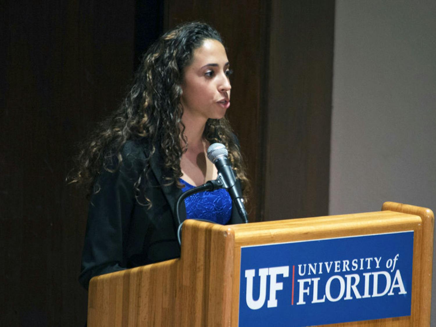 Joselin Padron-Rasines, a political science and international studies junior, presents the Access Party opening statement for the University of Florida Student Government Executive Debate on Tuesday in the University Auditorium. Padron-Rasines is running as presidential candidate.