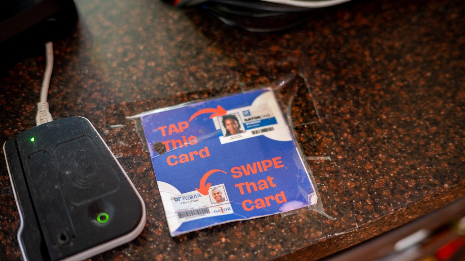 Students are prompted to pay with their GATORONE ID card at Rawlings Hall, Friday, Feb. 6, 2026, in Gainesville, Fla.