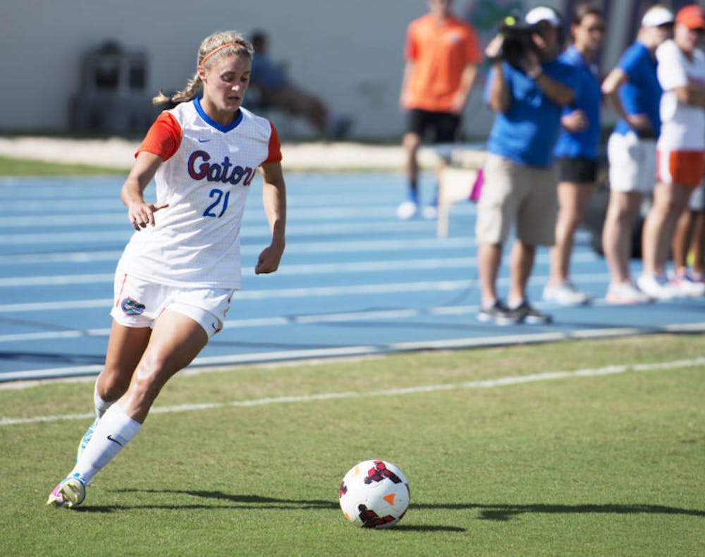 <p>Jillian Graff dribbles the ball during Florida’s 3-0 victory against Auburn on Oct. 6 at James G. Pressly Stadium. The junior lost her father to lung cancer in 2012 but fights on in his memory.</p>