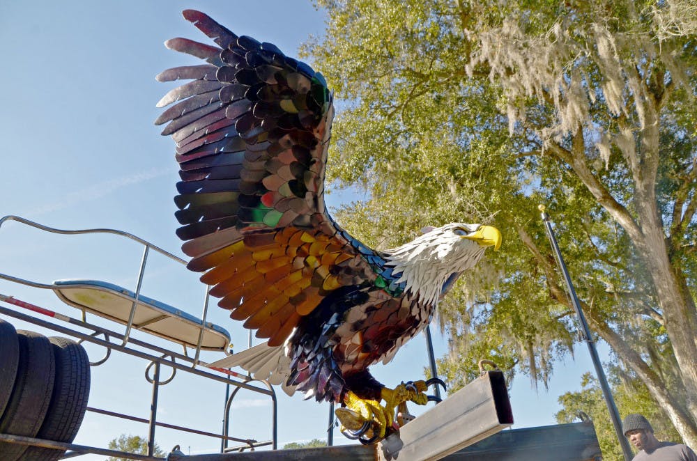 An eagle sculpture displayed at the park is made of recycled shipping containers and beer kegs.