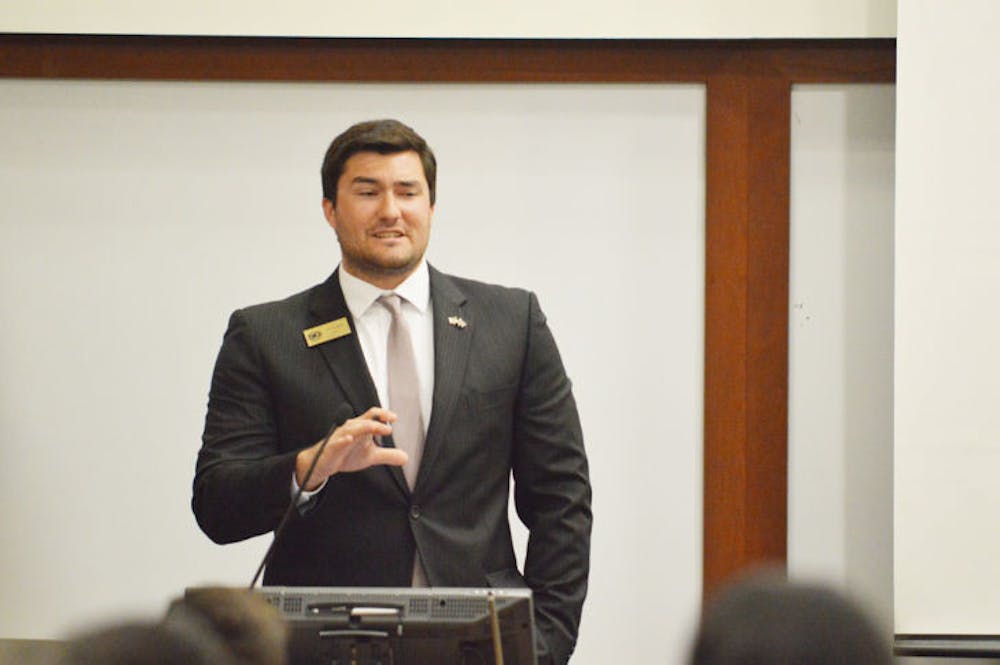<p class="p1">Sen. Davis Bean, chairman of the budget and appropriations committee, discusses the 2014-2015 Student Government-funded organizational budget during Tuesday’s Student Senate meeting.</p>