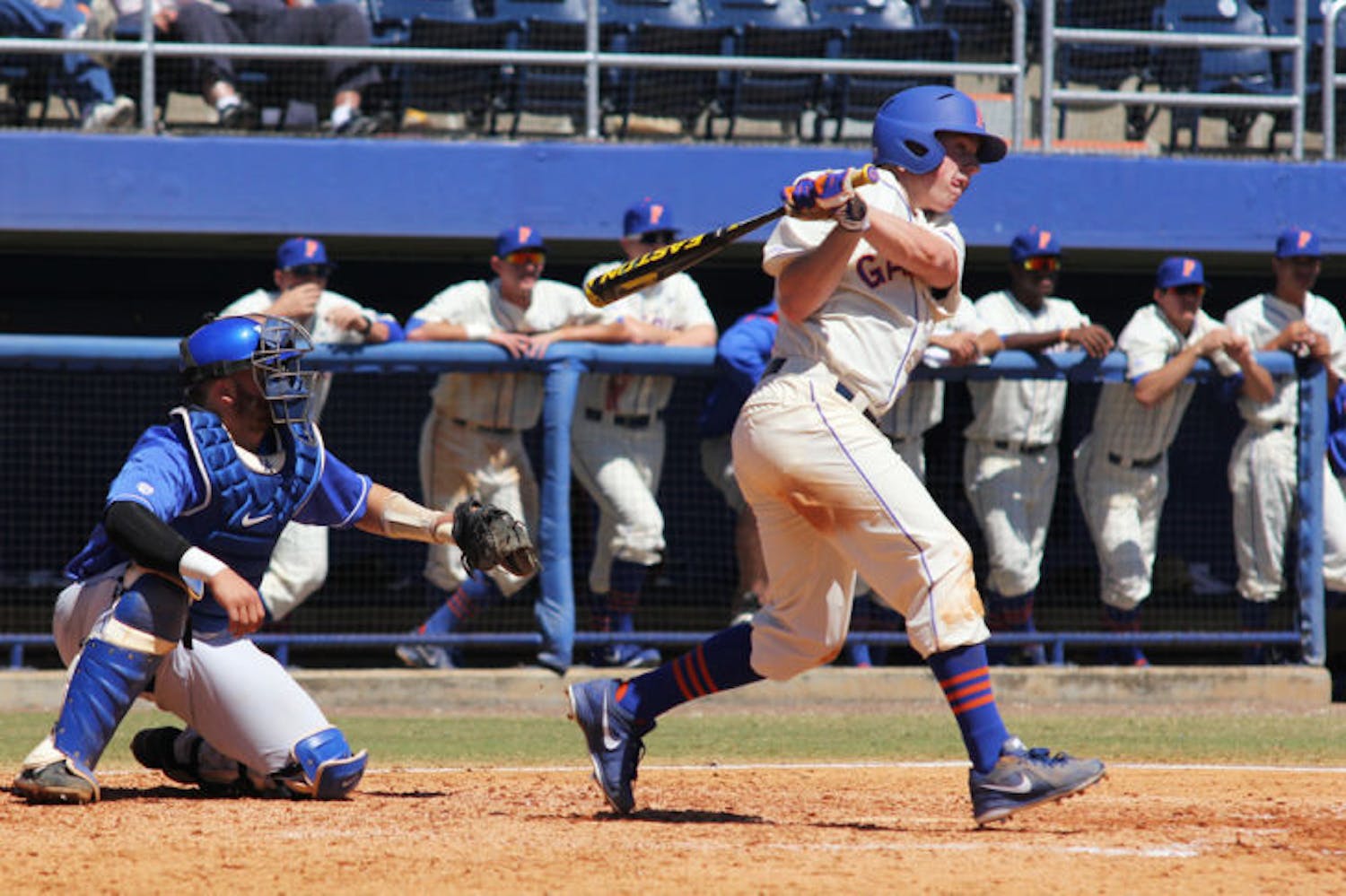 Sophomore right fielder Connor Mitchell (13) swings during Florida’s 11-5 loss to Kentucky on Saturday at McKethan Stadium. Mitchell went 3 for 8 in the Gators' series against the Wildcats.