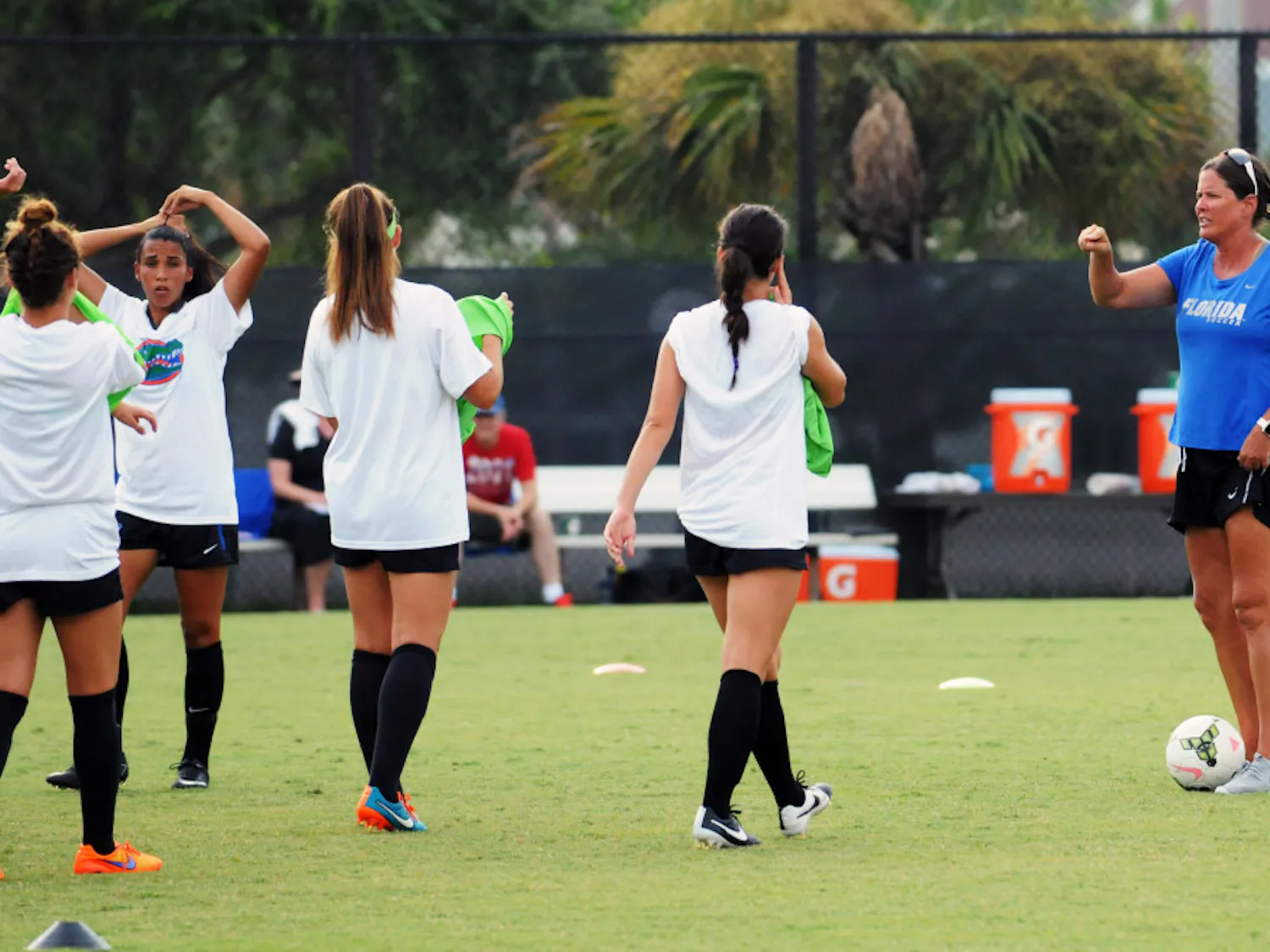UF soccer coach Becky Burleigh leads practice prior to Florida's 2-1 win against Troy in an exhibition match on Aug. 11, 2015, at the soccer practice field at Donald R. Dizney Stadium.