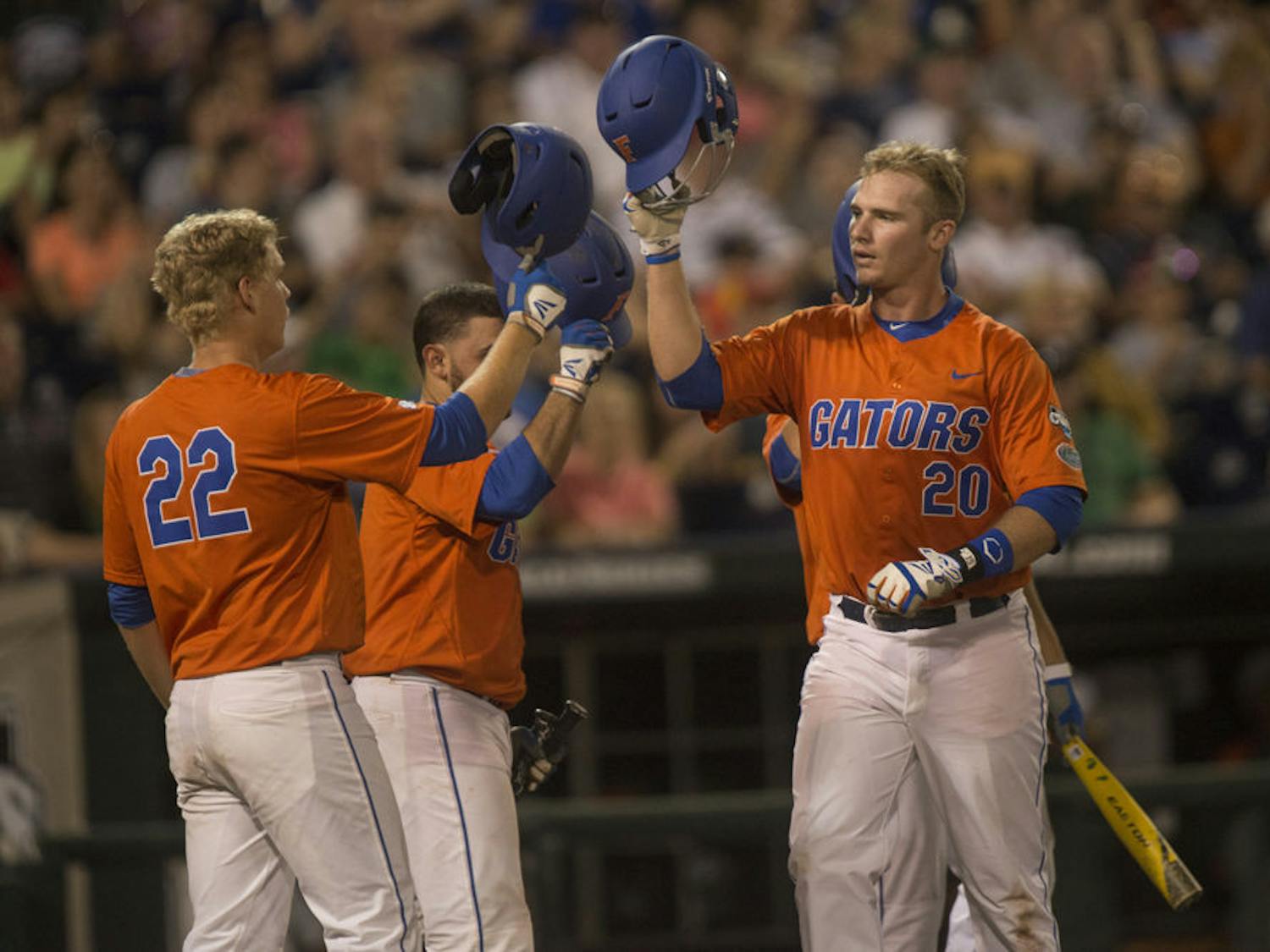 Florida sophomore infielder Peter Alonso (20) reacts after scoring a home run at the top of the seventh inning during the Gators' 10-2 victory against Miami in the NCAA Men's College World Series on Wednesday, June 17, 2015 the TD Ameritrade Park in Omaha.