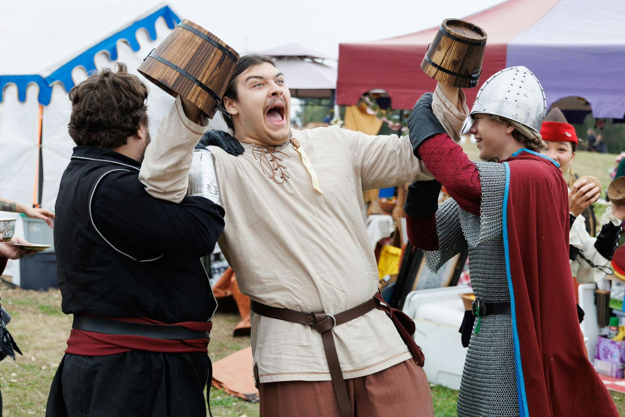 Michael Riling drags Josh Wyrosdick with Daniel West at the Hoggetown Medieval Faire at Depot Park, Sunday, Jan. 25, 2026.