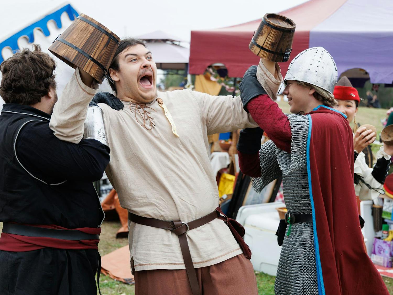 Michael Riling drags Josh Wyrosdick with Daniel West at the Hoggetown Medieval Faire at Depot Park, Sunday, Jan. 25, 2026.