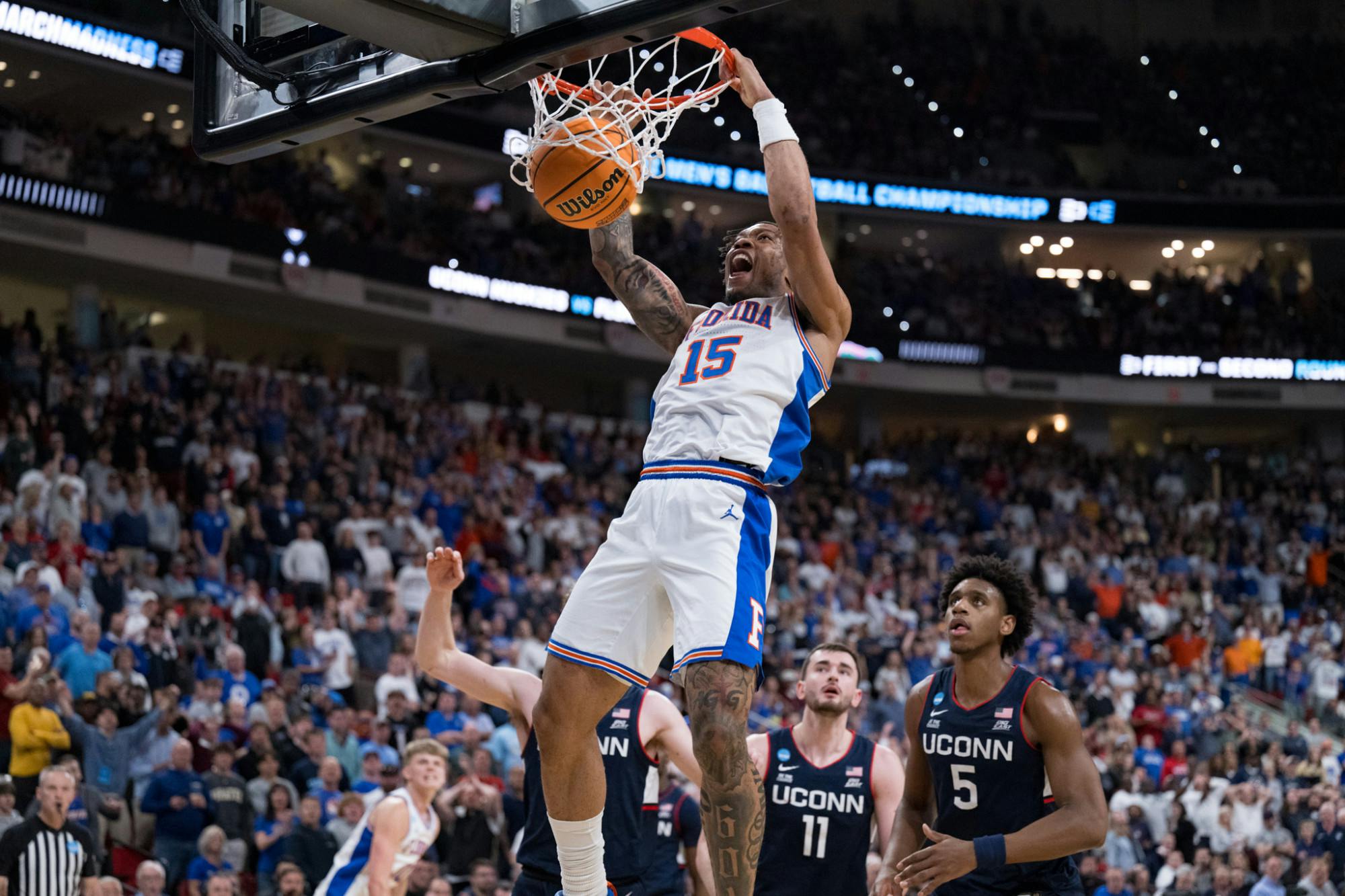 Florida Gators guard Alijah Martin (15) dunks the ball during a basketball game against UConn in the second round of the NCAA Tournament on Sunday, March 23, 2025, in Raleigh, N.C.