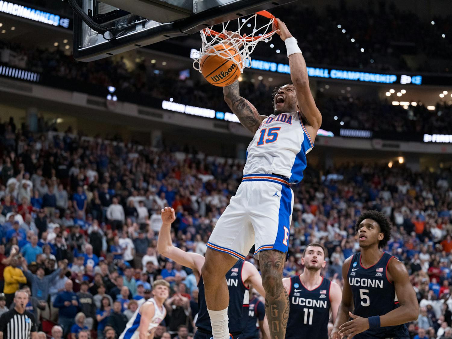Florida Gators guard Alijah Martin (15) dunks the ball during a basketball game against UConn in the second round of the NCAA Tournament on Sunday, March 23, 2025, in Raleigh, N.C.