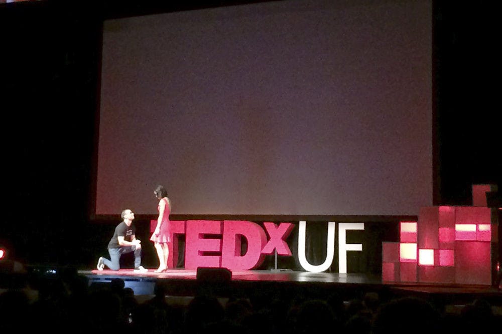 Rob Castellucci, co-founder of RoomSync and founder of the Gator Salsa Club, proposes to his girlfriend after the end of his talk at TEDxUF on Saturday. “I would go on for a thousand more reasons, but I’m pretty sure my 18 minutes is almost up,” Castellucci said. “Will you marry me?”