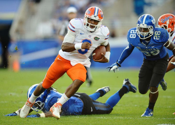 Tyler Murphy runs the ball during Florida’s 24-7 victory against Kentucky on Saturday at Commonwealth Stadium in Lexington, Ky. Murphy completed 15 of 18 passes for 156 yards during his first college start.