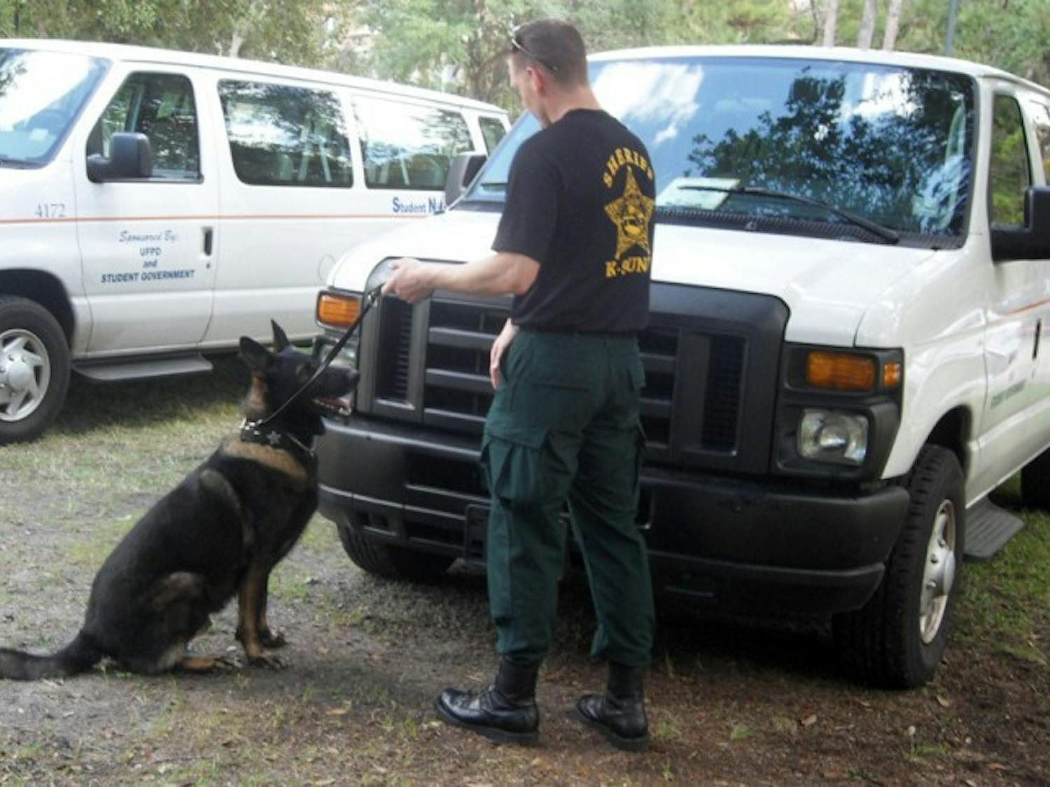 A German Shepherd police dog, Apollo, is led by Marion County Sheriff's Office Deputy Greg Combs. Apollo sniffs out narcotics for his yearly certification requirements.
