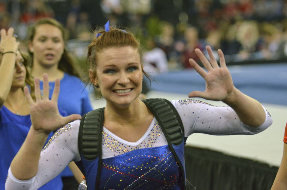 UF’s Bridget Sloan celebrates her Perfect 10 on the uneven bars during the 2015 Southeastern Conference Championships.