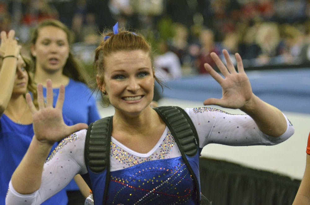 <p>UF’s Bridget Sloan celebrates her Perfect 10 on the uneven bars during the 2015 Southeastern Conference Championships.</p>