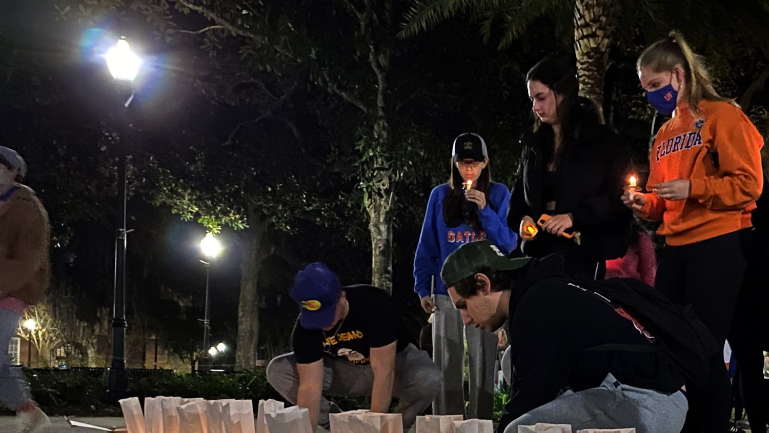 UF students and community members gathered at Plaza of the Americas for a commemorative candlelight vigil to honor the victims of the Parkland shooting on Monday, Feb. 14. 