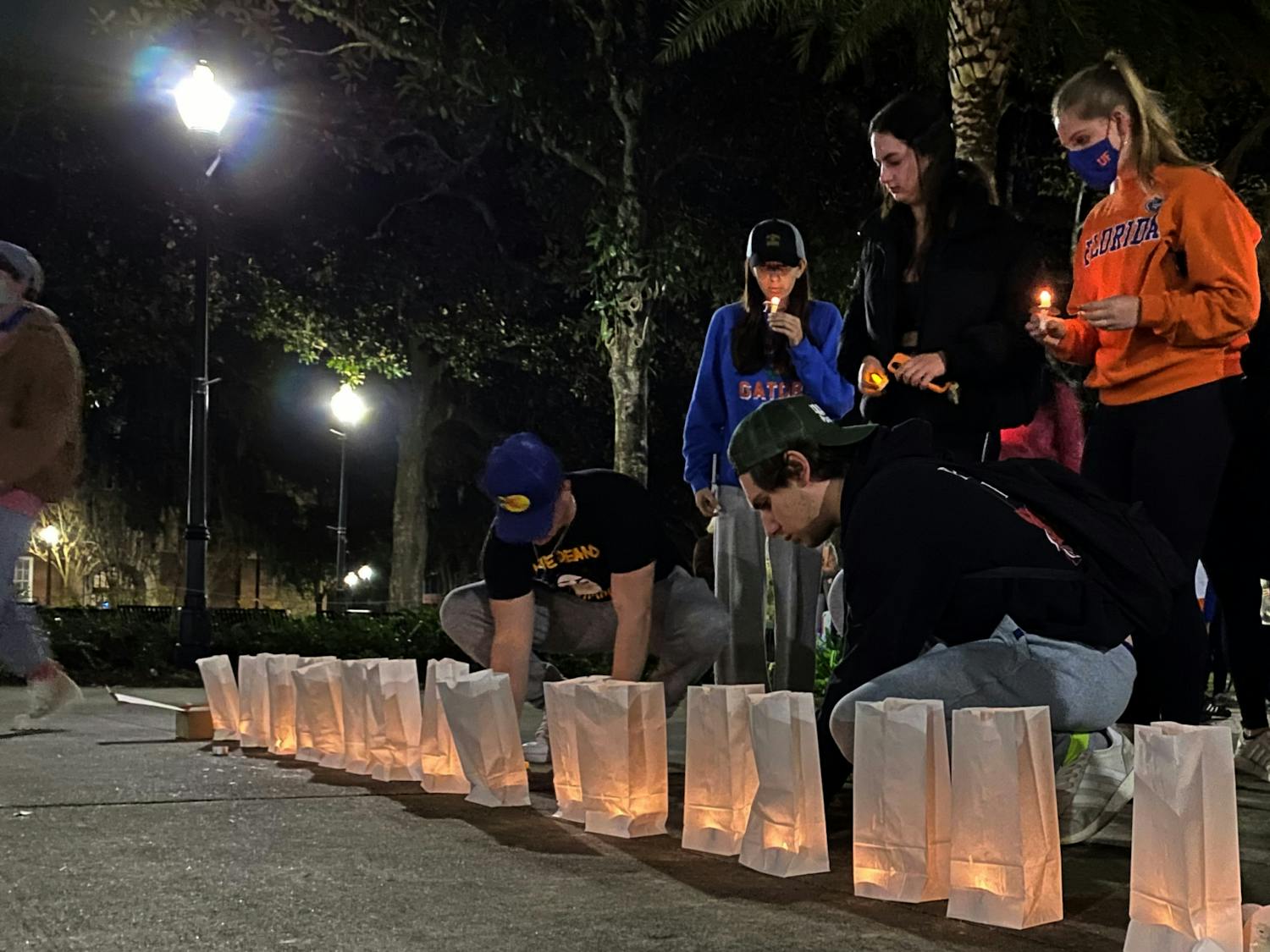 UF students and community members gathered at Plaza of the Americas for a commemorative candlelight vigil to honor the victims of the Parkland shooting on Monday, Feb. 14. 