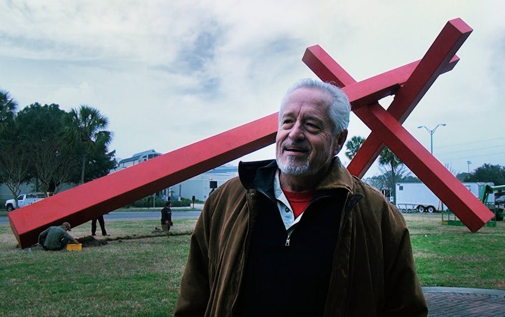 <p>John Raymond Henry stands in front of his piece &quot;Big Max&quot; at the Harn Museum of Art in Gainesville, Florida. </p>