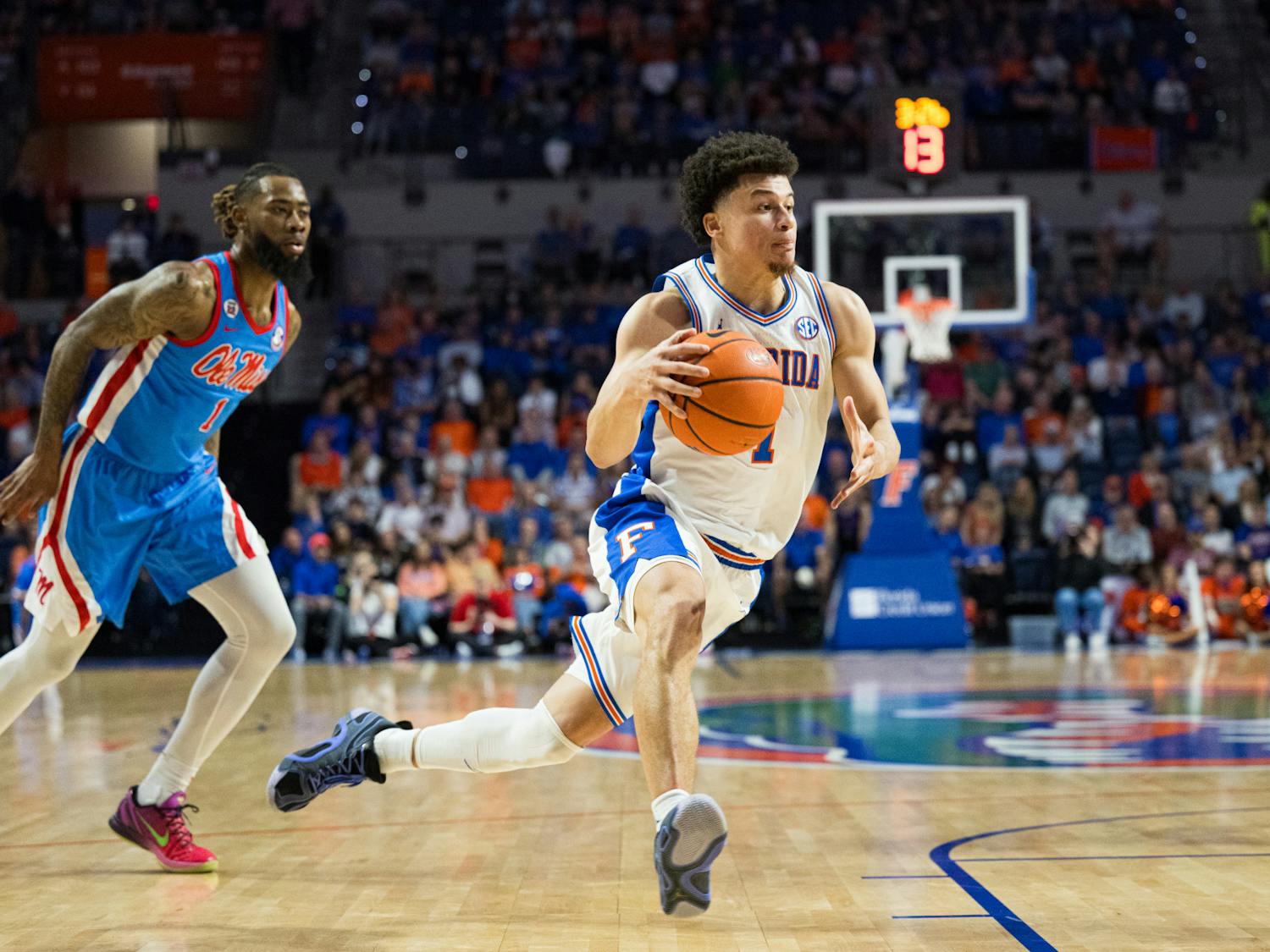 Florida Gators guard Walter Clayton Jr. (1) drives with the ball in a basketball game against Ole Miss on Saturday, March 8, 2025, in Gainesville, Fla.