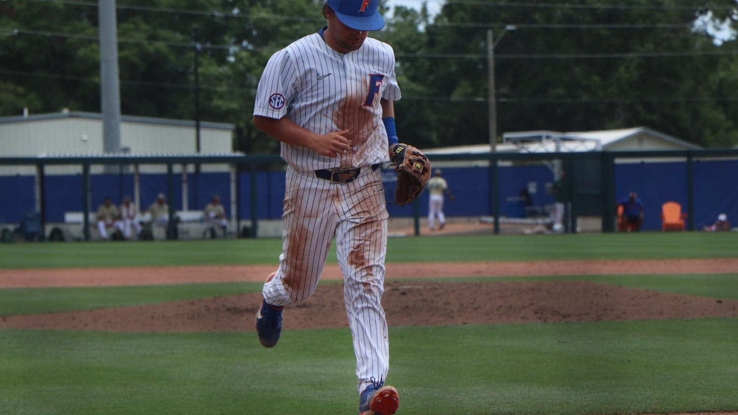 Florida’s Nathan Hickey walks towards the dugout Friday against South Florida. The Gators lost 19-1 against South Alabama Saturday to be swept out of their host regional and end their season.