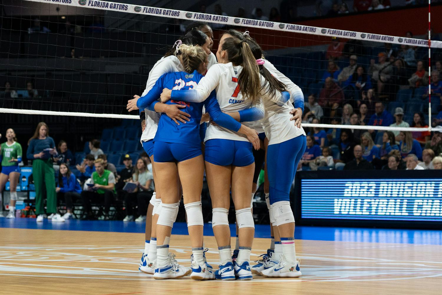The Gators volleyball team embraces each other in Florida's 3-0 win against Florida Gulf Coast on Thursday, Nov. 30, 2023.