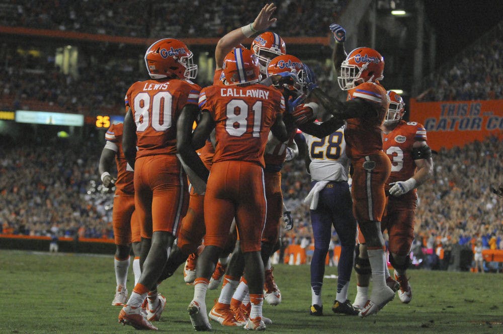 <p>UF wide receiver Antonio Callaway celebrates with teammates after Demarcus Robinson scores a touchdown during Florida's 31-24 win against East Carolina on Sept. 12, 2015, at Ben Hill Griffin Stadium.</p>