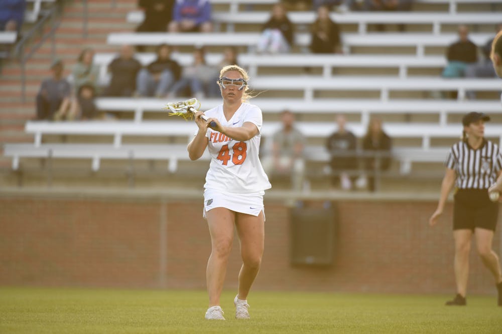 Florida lacrosse graduate student Paisley Eagan looks to pass the ball in the team's exhibition against the Scotland National Team on Wednesday, February 14, 2024. 