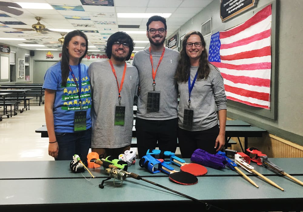 <p><span id="docs-internal-guid-d922c633-c55b-c34d-8040-df3c60ff8e0d"><span>Members of UF GRiP, a club that 3-D prints activity-specific prosthetics, pose with some of their newer models at Hand Camp 2017, a gathering of children with limb differences held from Friday to Sunday in Starke, Florida.</span></span></p>