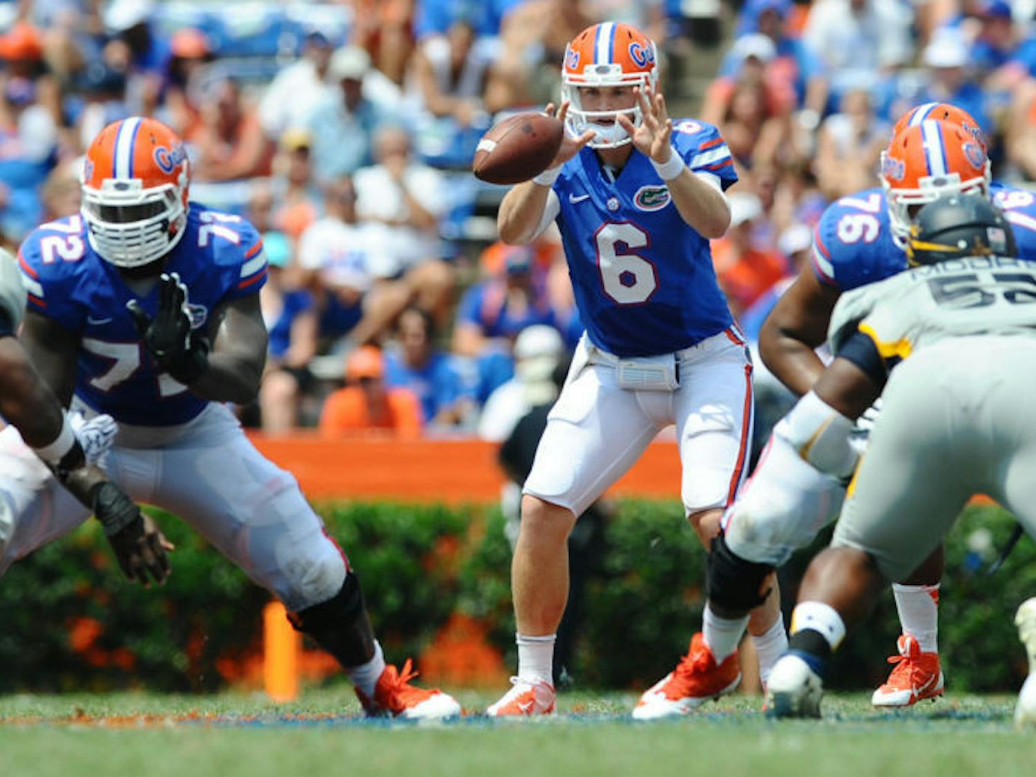 Jeff Driskel reaches for a snapped ball during Florida’s 24-6 victory against Toledo on Saturday in Ben Hill Griffin Stadium. Driskel completed 17 of 22 passes for 153 yards and a touchdown in the game.