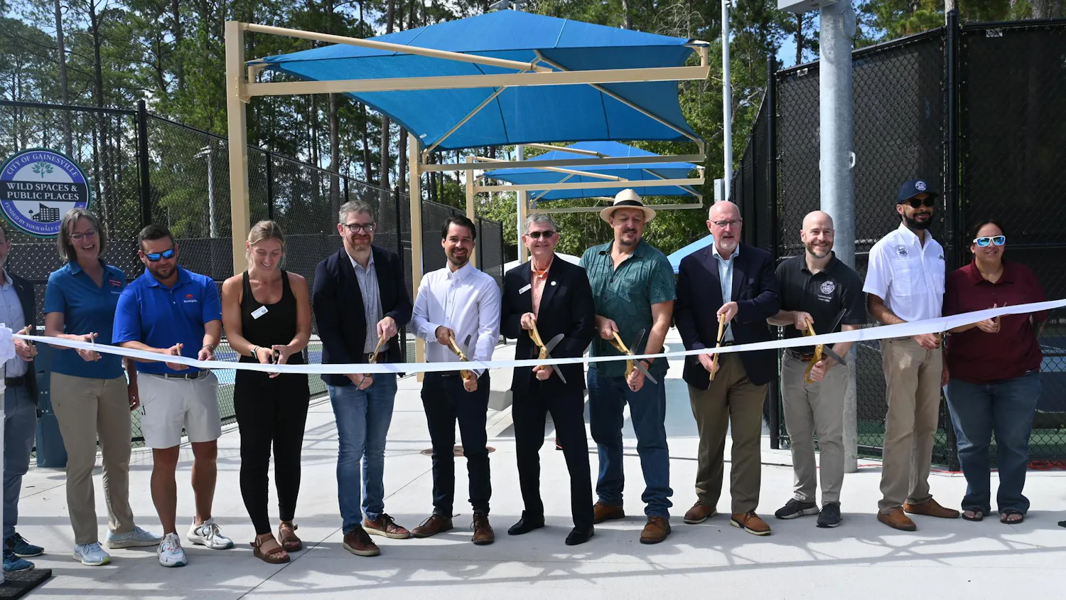 Gainesville Mayor Harvey Ward and other city leaders cut a ribbon commemorating the opening of new pickleball courts and park renovations, Saturday, June 6, 2026, at Tom Petty Park in Gainesville, Fla.