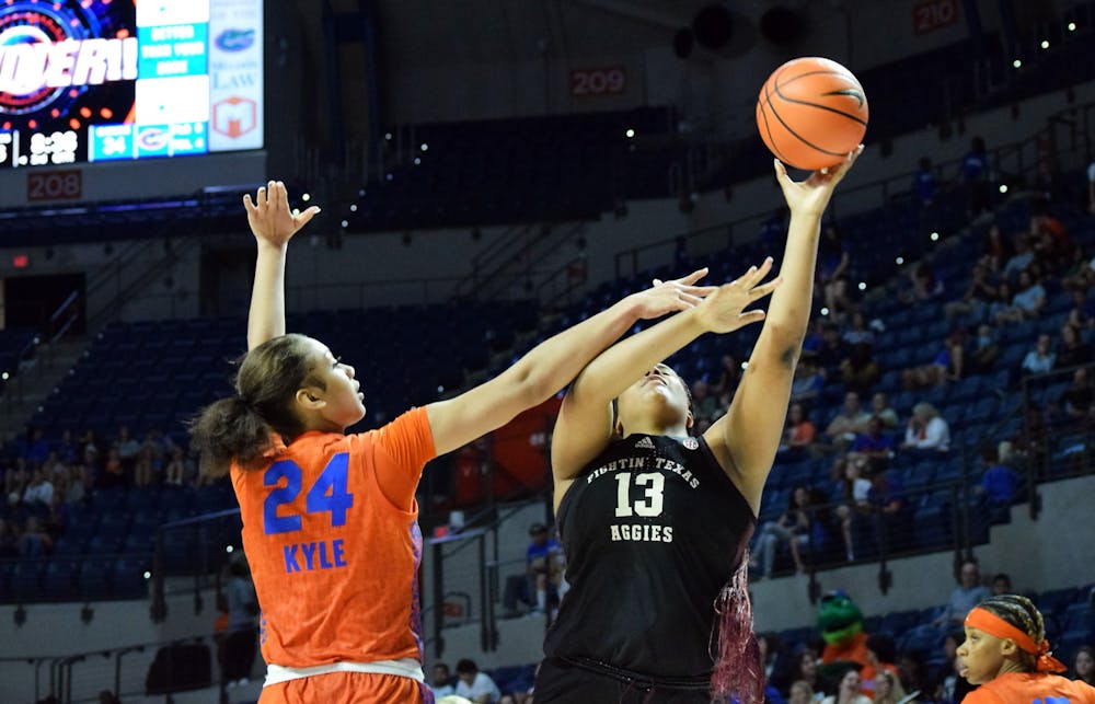 <p>Florida center Ra Shaya Kyle contests a Texas A&amp;M shot in the Gators&#x27; 61-54 victory against the Aggies. Kyle had a career-high 17 rebounds in the win.﻿</p>