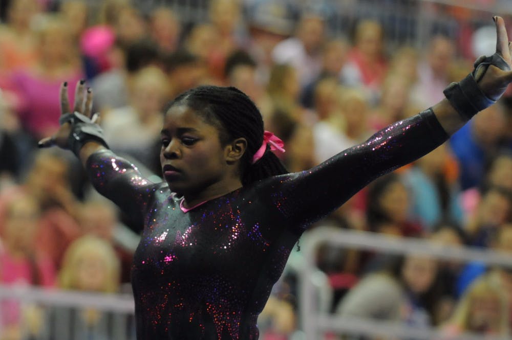 <p>Alicia Boren performs on the balance beam during Florida's win against Arkansas on Feb. 12, 2016, in the O'Connell Center.</p>