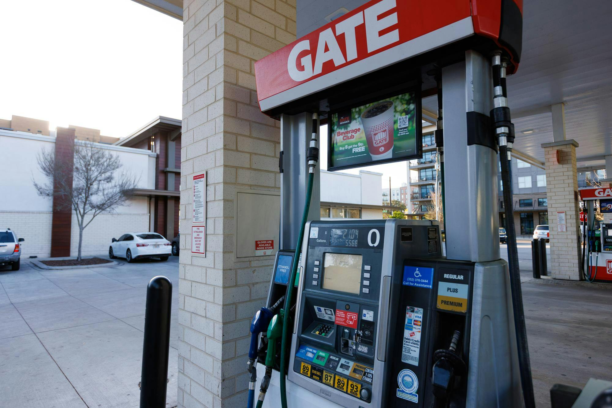 A gas pump displays current gas prices at a Gate gas station on Friday, March 13, 2026, in Gainesville, Fla.