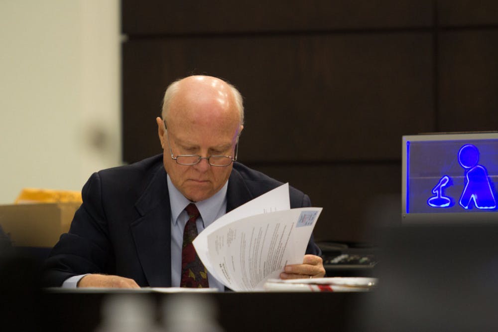 The clerk of court reviews evidence in court on Friday