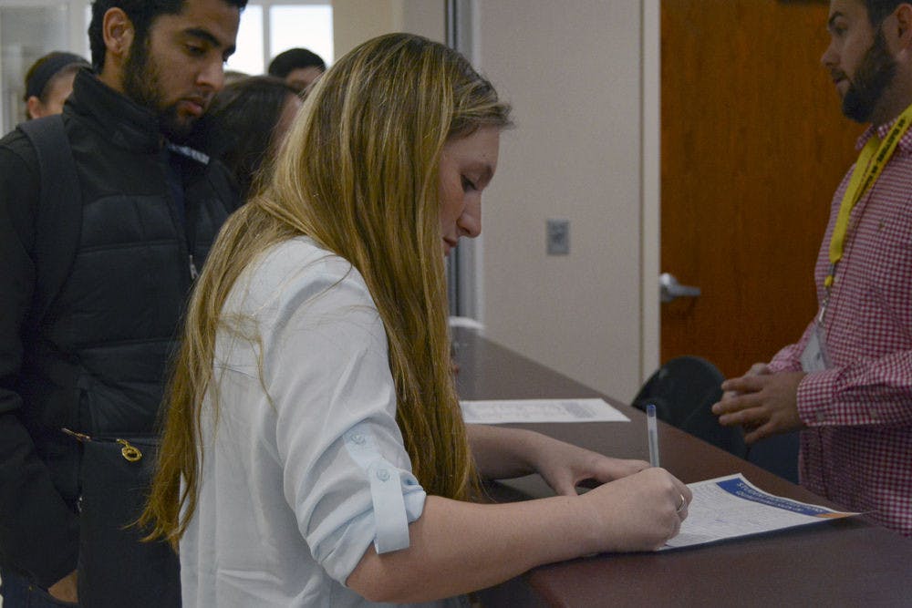 Francesca Faborule, a 19-year-old UF business sophomore, prepares for slating on the third floor of the Reitz Union on Tuesday afternoon.
