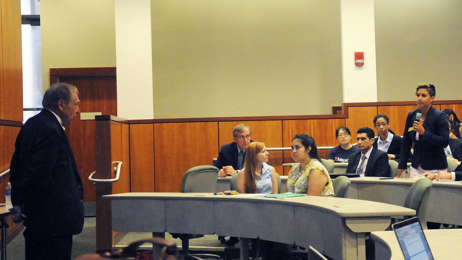 UF student Denae Campanale (right) addresses her concerns about diversity to Winfred Phillips, chairman of President Kent Fuchs' goal-setting task force, at the student town hall meeting on July 7, 2015, at the UF Levin College of Law.
