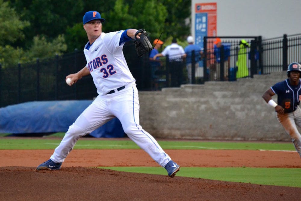 <p>UF right-handed pitcher Logan Shore throws a pitch during Florida's 4-1 loss to Auburn on May 15, 2015, at McKethan Stadium.</p>