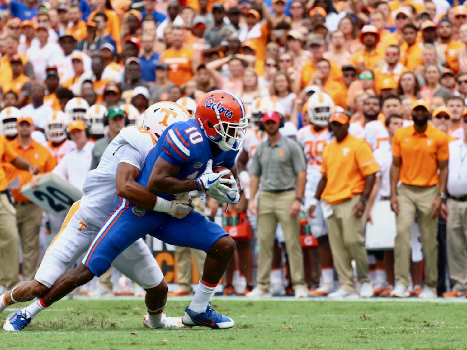 UF receiver Josh Hammond gets tackled while holding the ball during Florida's 26-20 win against Tennessee on Sep. 16, 2017, at Ben Hill Griffin Stadium.