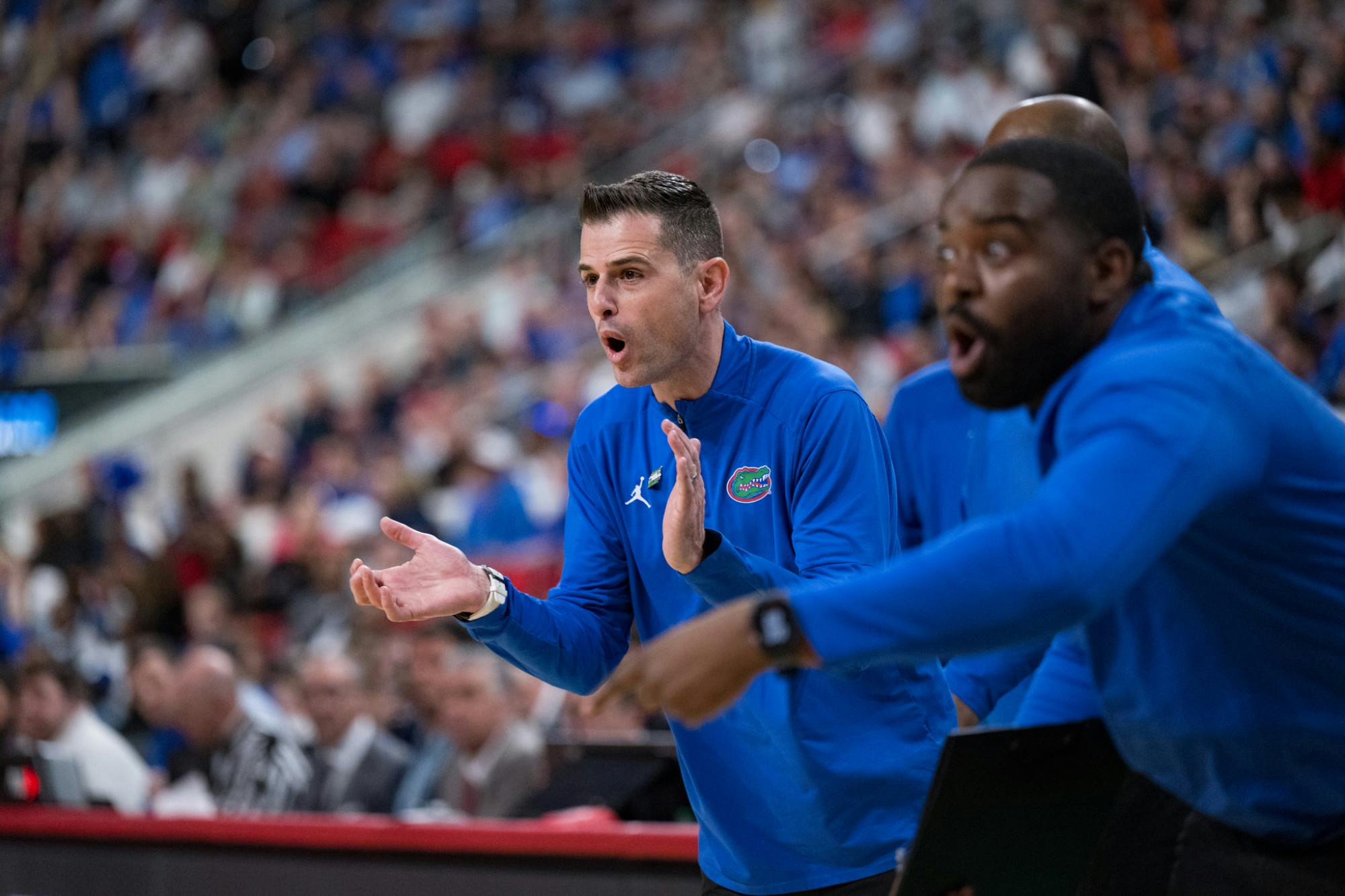 Florida Gators head coach Todd Golden encourages his team during a basketball game against UConn in the second round of the NCAA Tournament on Sunday, March 23, 2025, in Raleigh, N.C.